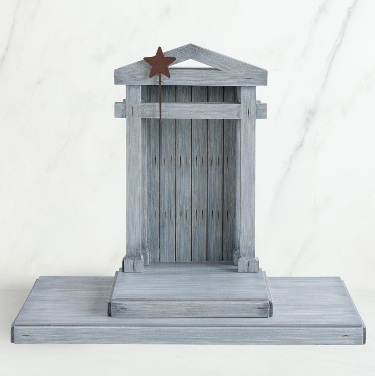 Grey wooden barn figurine open - brown star standing on it