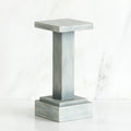 Standing white wooden pedestal stand against white background