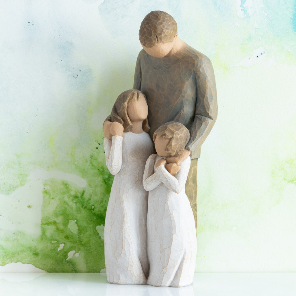 Willow Tree My Girls, 8"h hand-painted standing resin figure of father with arms around two young girls, all in neutral clothing, in front of green painting