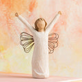 Willow Tree Courage, 6”h hand-painted standing resin angel figure in cream dress with wire wings, both arms upraised, in front of orange painting