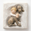 Close up of carved white square stone - in the middle is faceless young boy holding larger brown dog