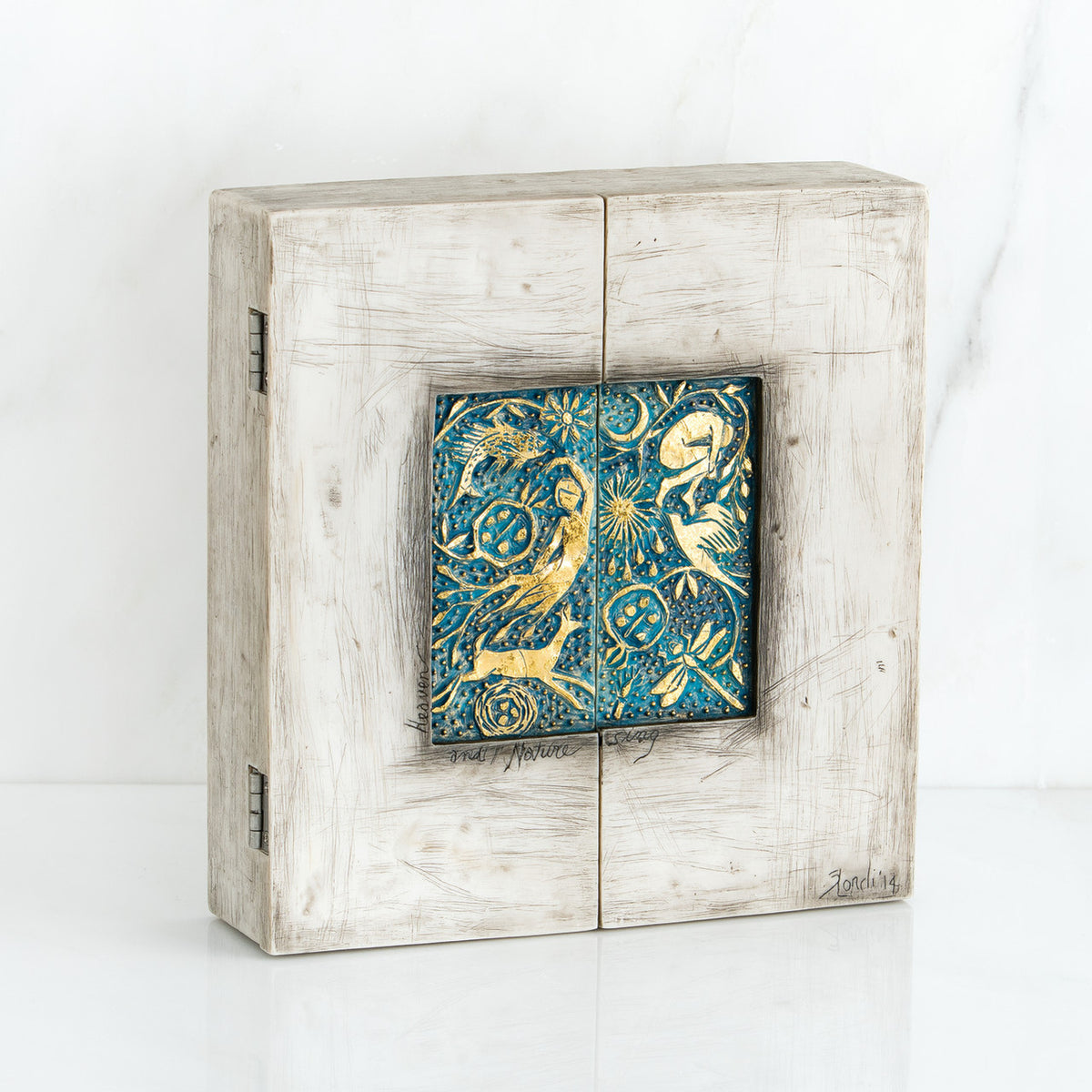 Light grey box with blue and gold scene square in the center
