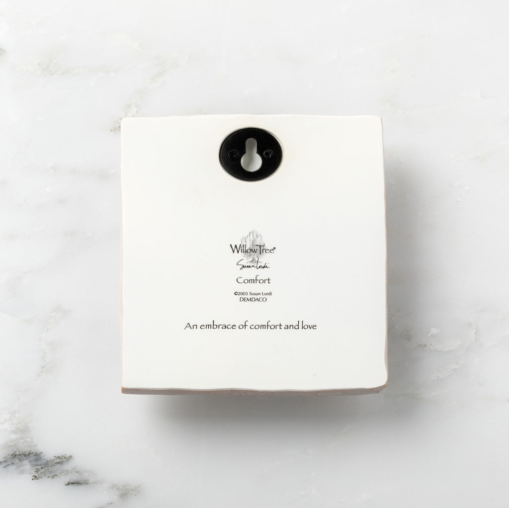 Back of white plaque reading piece title and sentiment, with Willow Tree logo