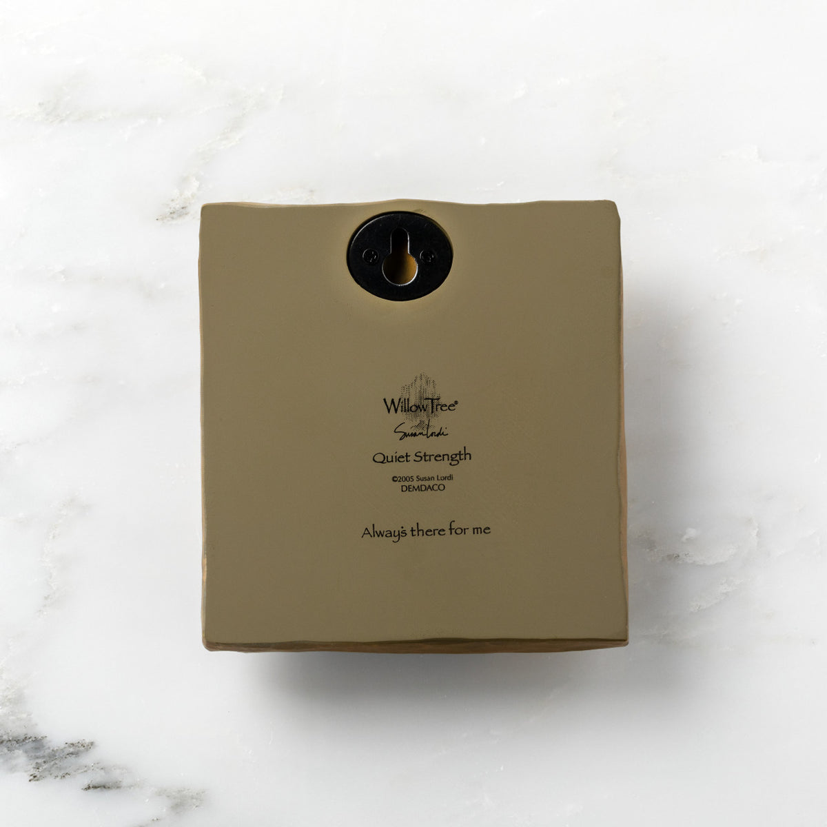 Back of olive-colored plaque reading "Quiet Strength" with Willow Tree logo
