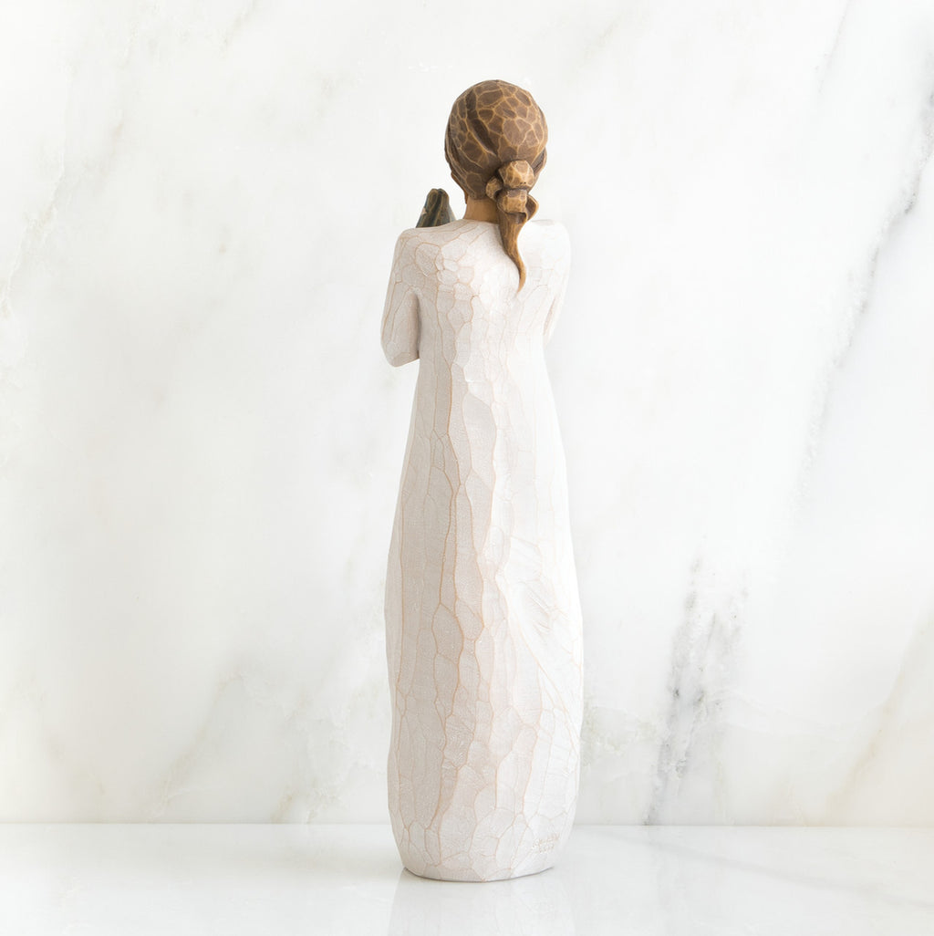 Back view of brunette woman in white dress standing up