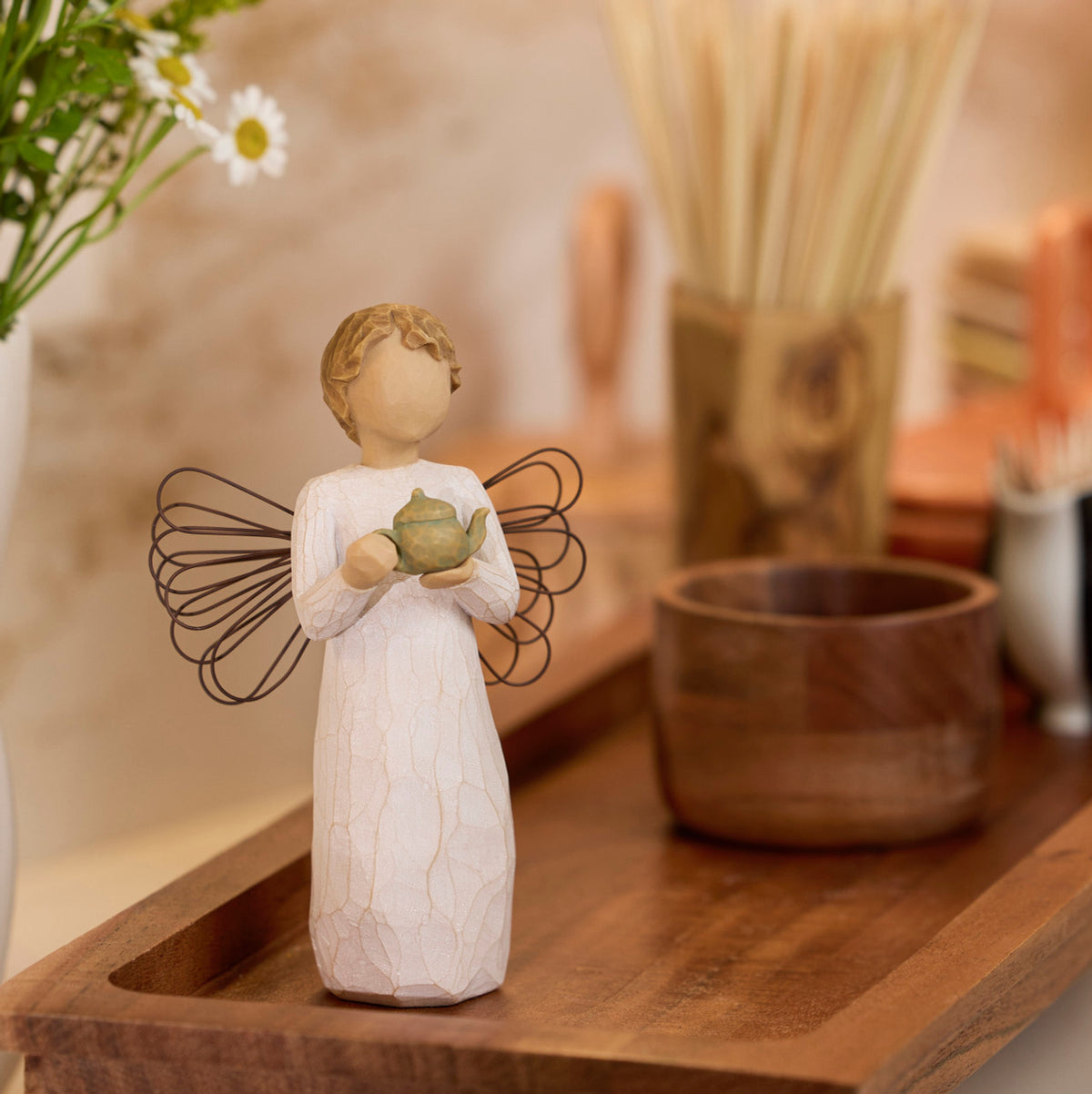 Willow Tree Angel of the Kitchen, 5.5”h hand-painted standing resin figure in cream dress with wire wings, holding green teapot, on dark wood tray